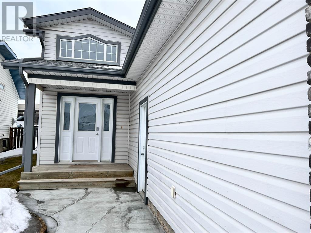 Exterior of Mission Heights family home at 7405 Kateri Dr, Grande Prairie, AB