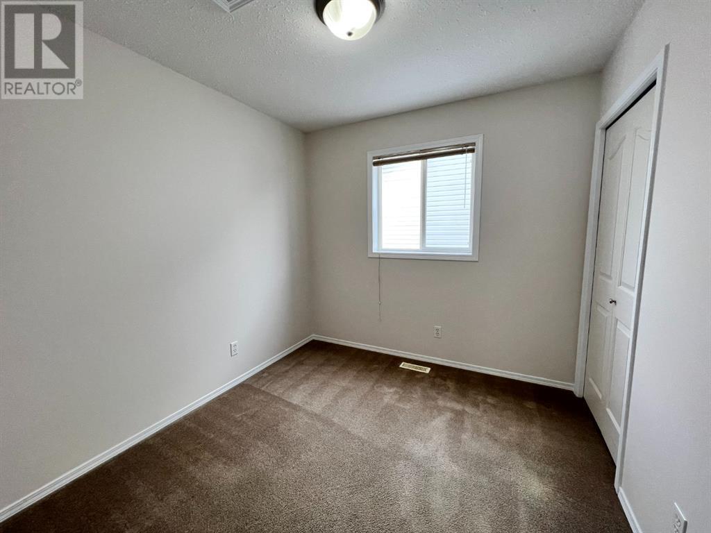 Grande Prairie Mission Heights family home — bedroom