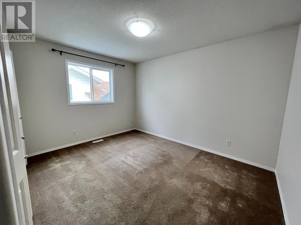 Grande Prairie Mission Heights family home — bedroom