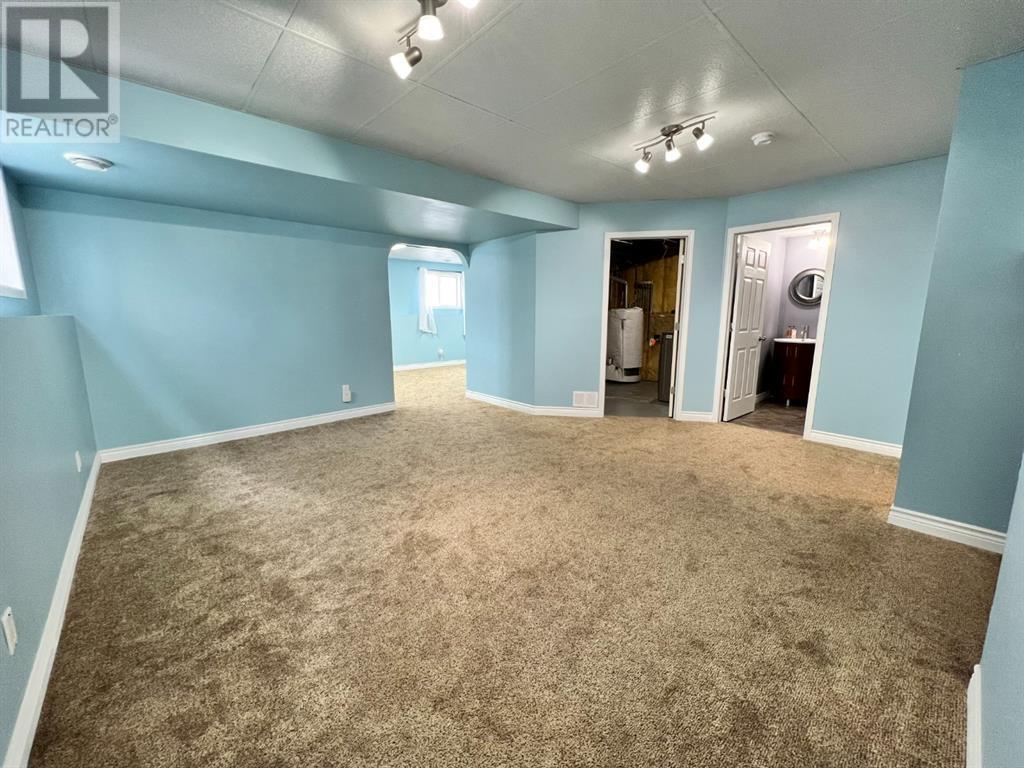 Grande Prairie Mission Heights family home — basement rec room