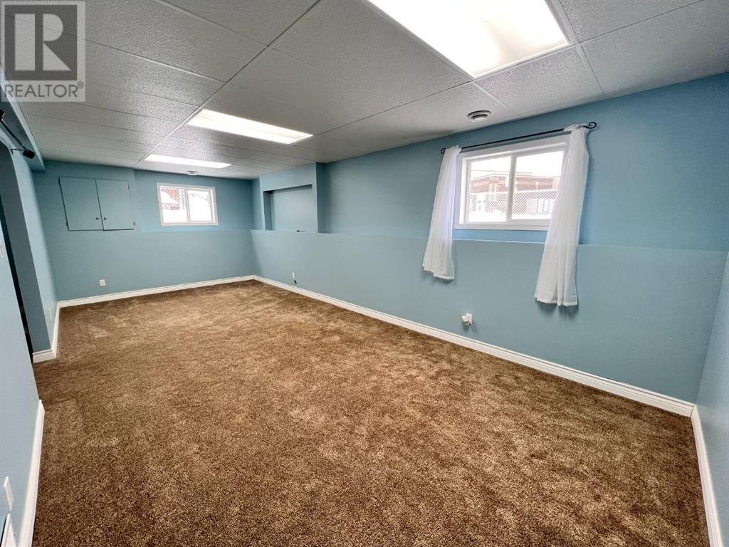 Grande Prairie Mission Heights family home — basement bedroom