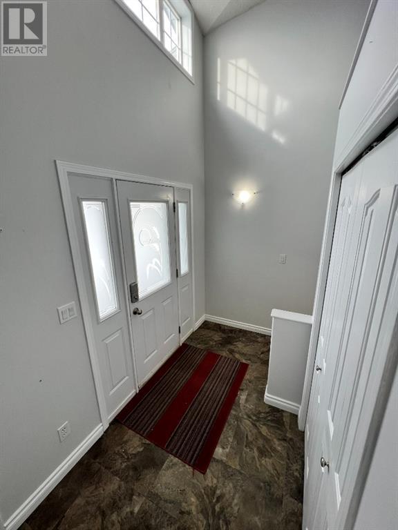Grande Prairie Mission Heights family home — grand entryway with high ceilings