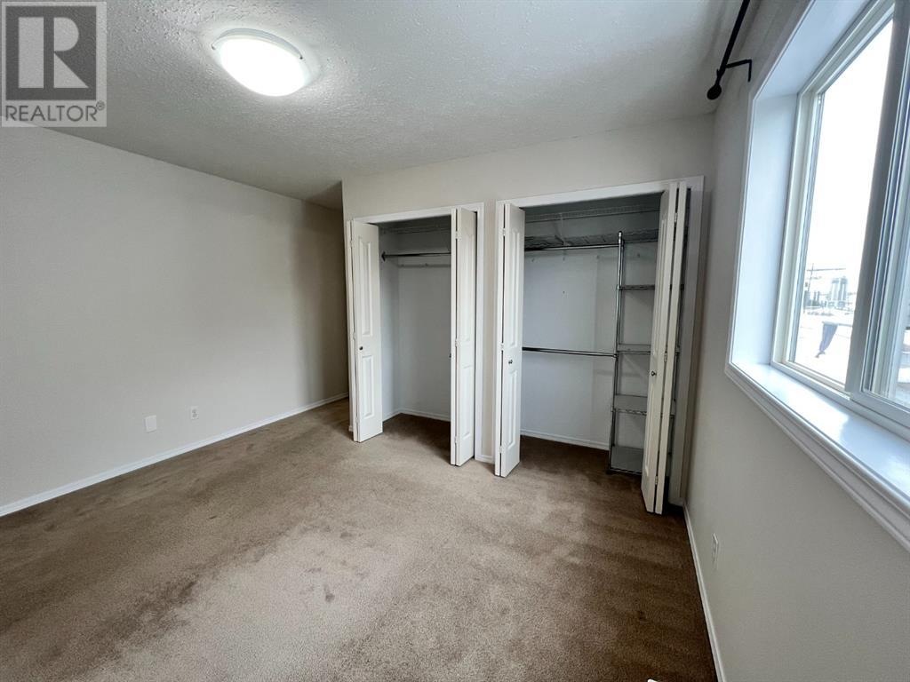 Grande Prairie Mission Heights family home — master bedroom with double closets