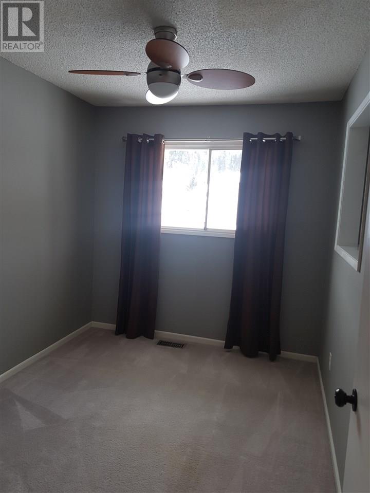 Prince George Foothills — bedroom with ceiling fan