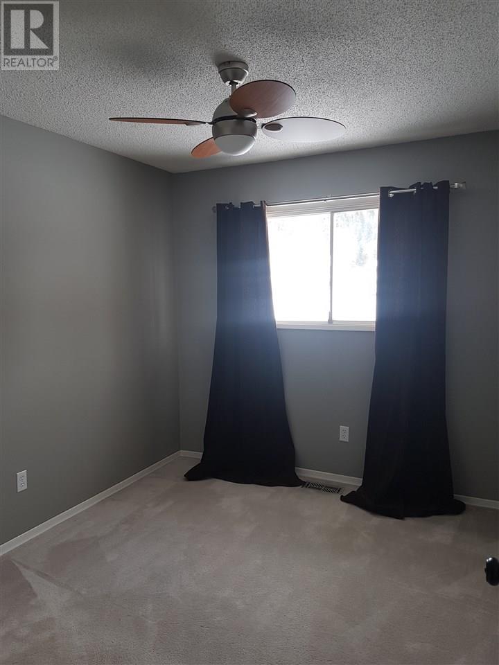 Prince George Foothills — bedroom with ceiling fan