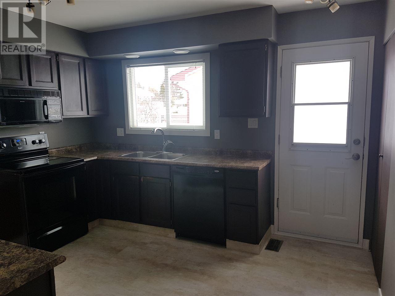 Prince George Foothills — kitchen sink and back door