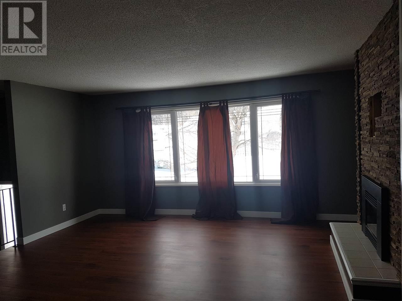 Prince George Foothills — living room with hardwood floors