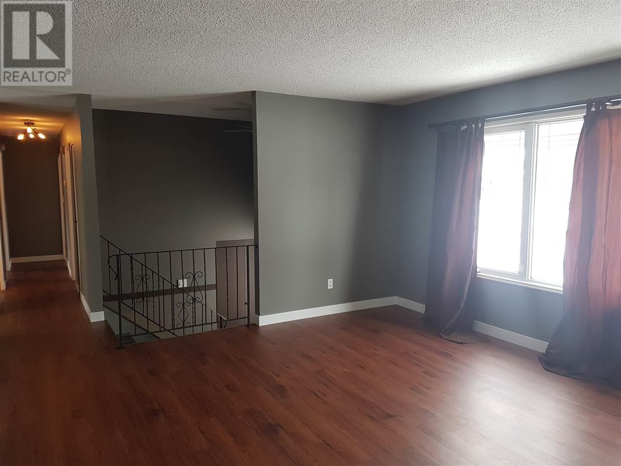 Prince George Foothills — open living area with staircase