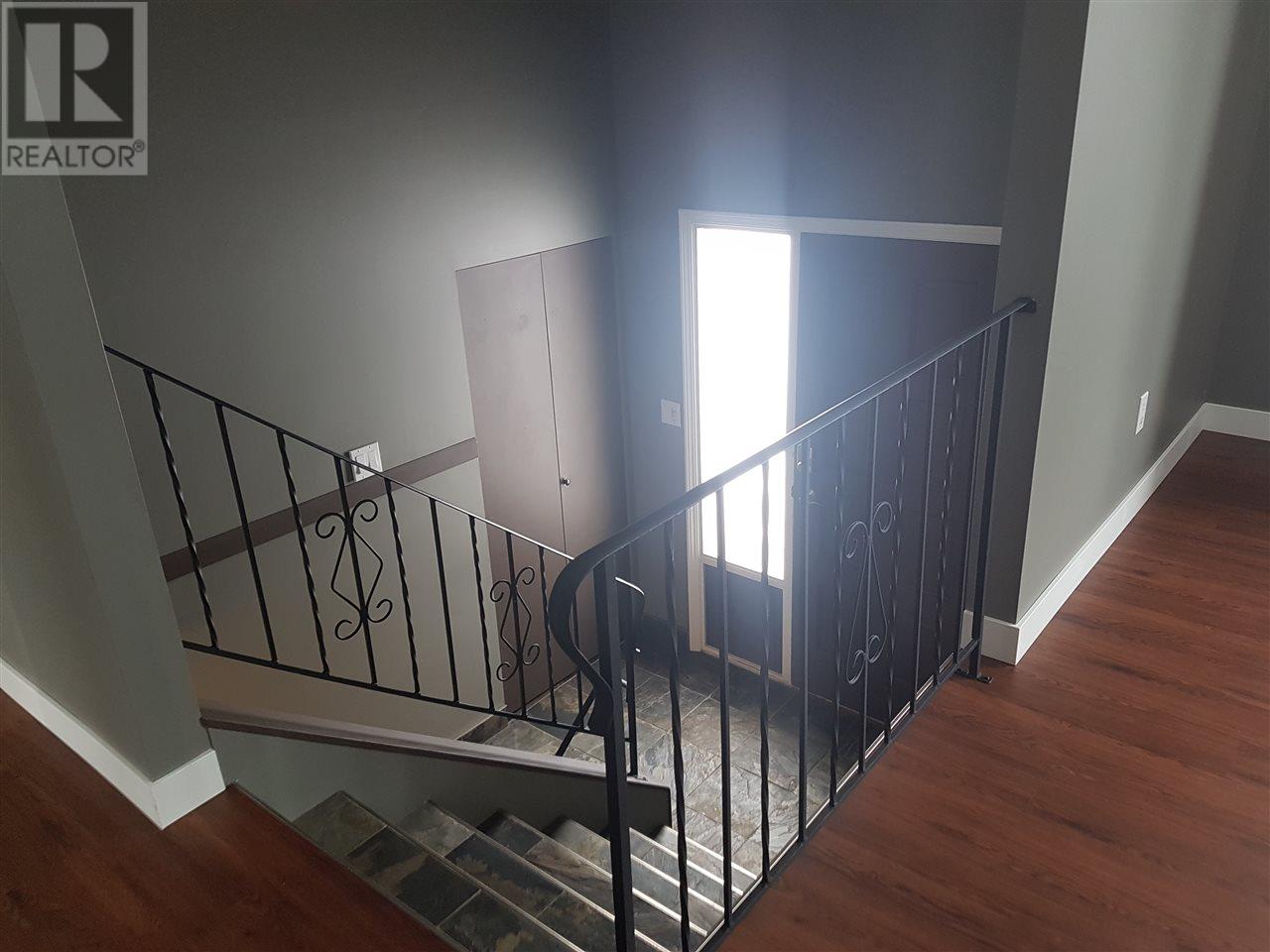 Prince George Foothills — staircase with iron railing